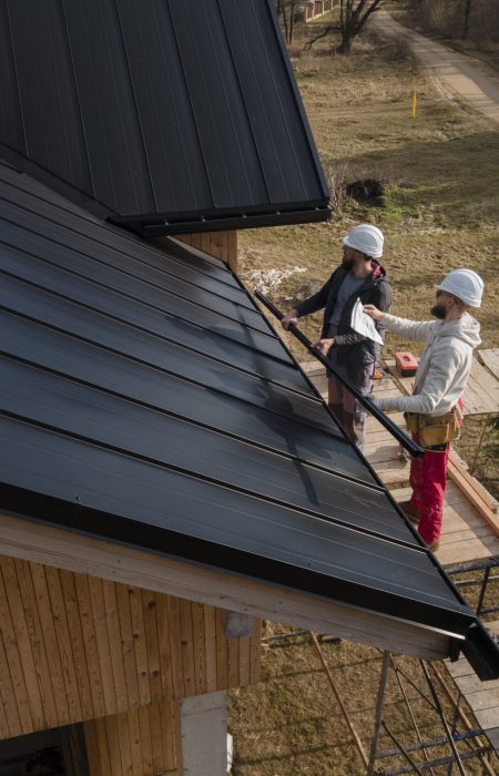 full-shot-roofers-working-with-helmets